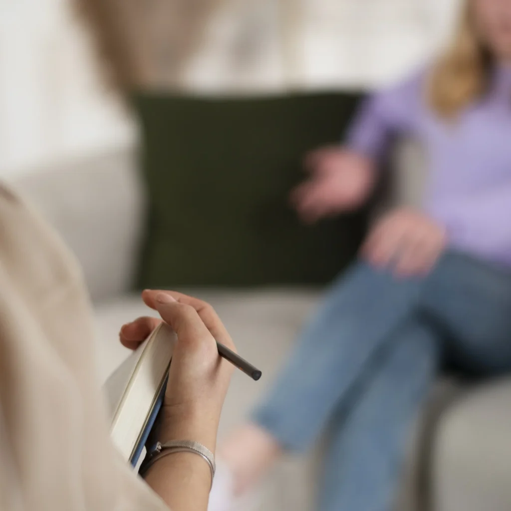 sided-view-young-girl-talking-therapist sided-view-young-girl-talking-therapist